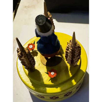 Yellow Reuge music box with gnome, vintage Swiss clock components, perfect for collectors