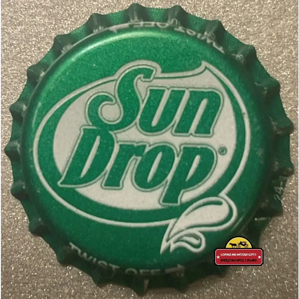 Vintage green Sun Drop bottle cap with white logo and textured edge