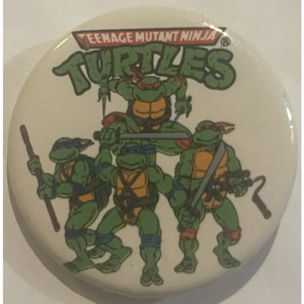 Circular button with Teenage Mutant Ninja Turtles logo and characters for collectors