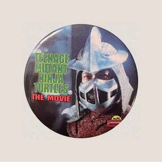 Vintage Teenage Mutant Ninja Turtles Shredder movie pin button featuring Teenage Mutant Ninja Turtles logo