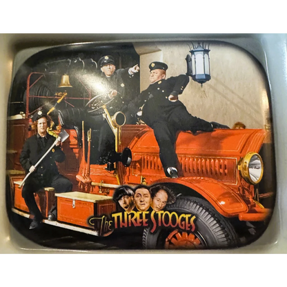 Orange vintage fire truck lunch box from 1999 featuring Three Stooges classic design