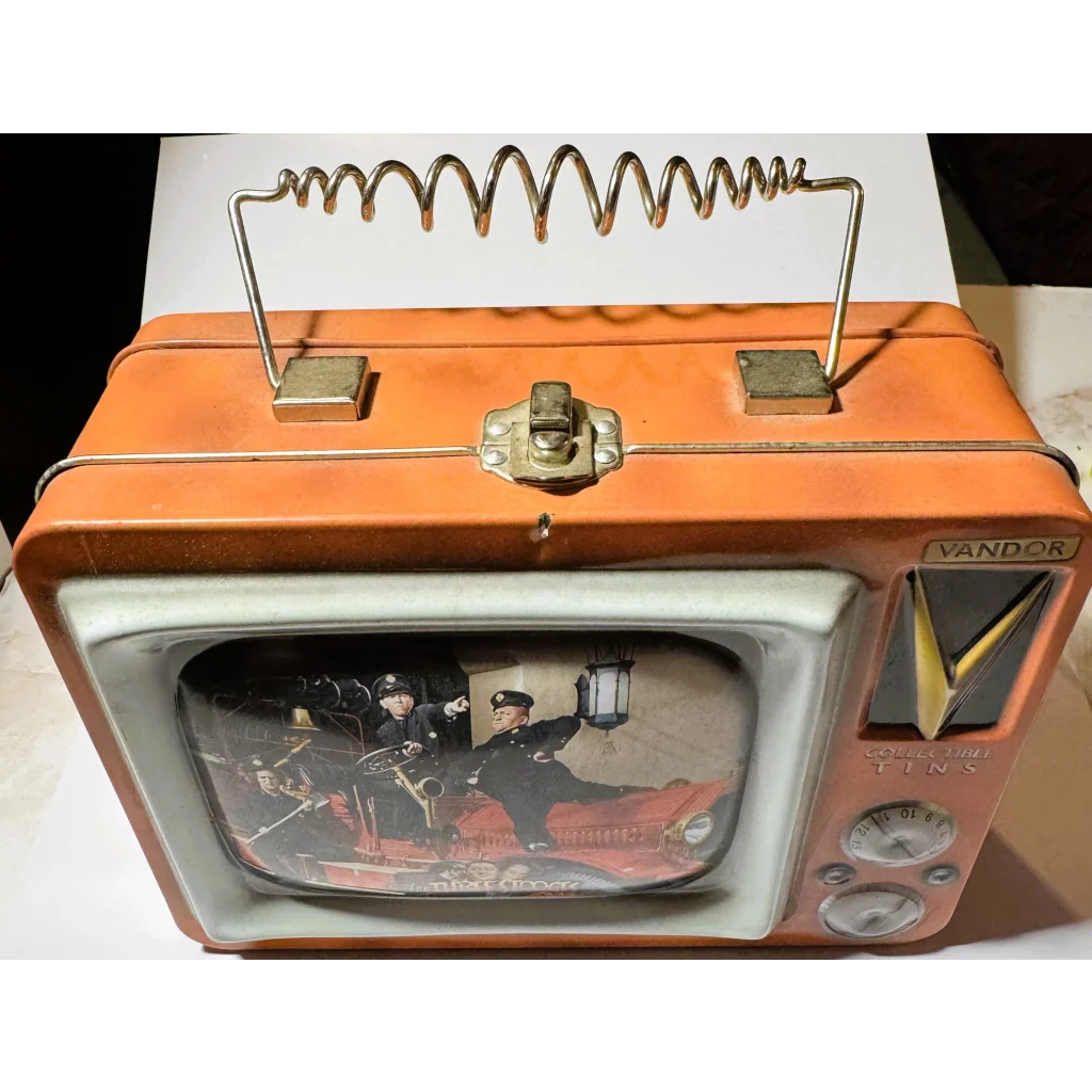 Vintage Three Stooges lunch box with a retro orange and white portable TV and spring antenna