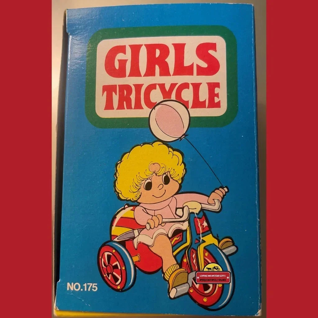 Book cover of Nostalgic Vintage Tin Wind Up Girls Tricycle Toy showing a girl on a trike