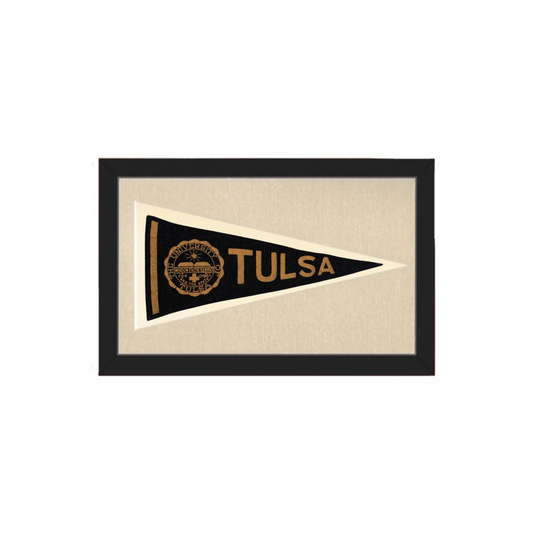 Black and gold vintage pennants of Tulsa University displayed in a black frame for wall decor or collection