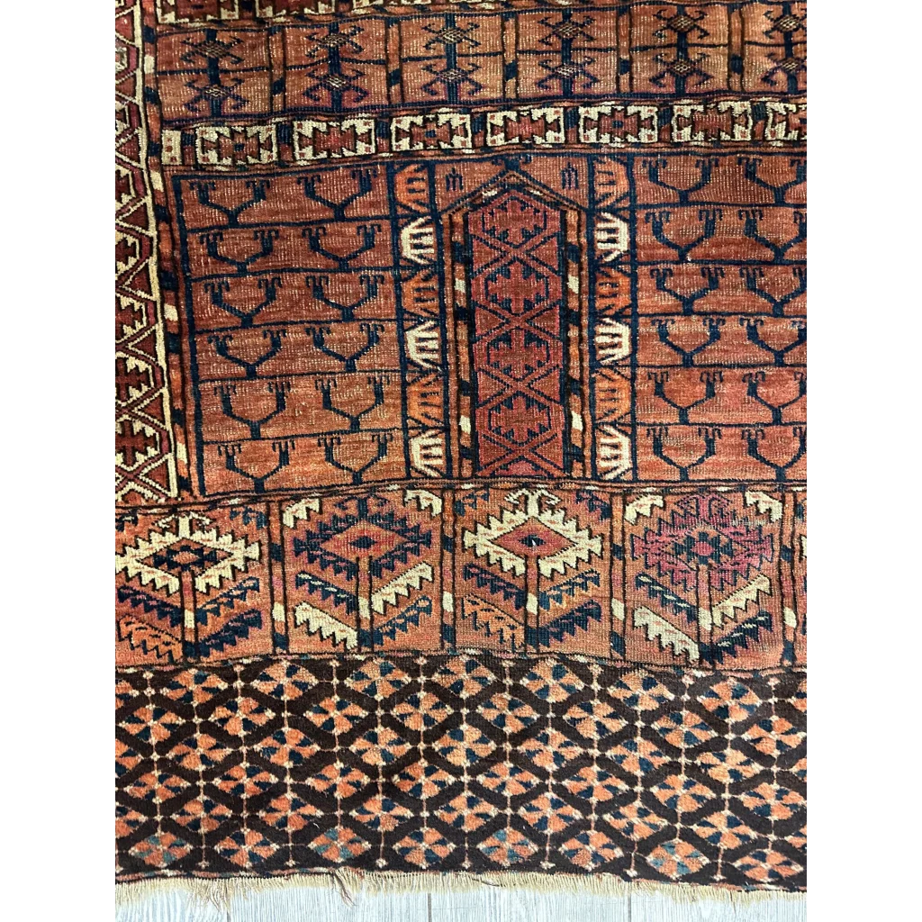 Vintage Turkmen geometric rug in rust navy and cream tones