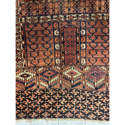 Vintage Turkmen geometric rug in rust navy and cream tones
