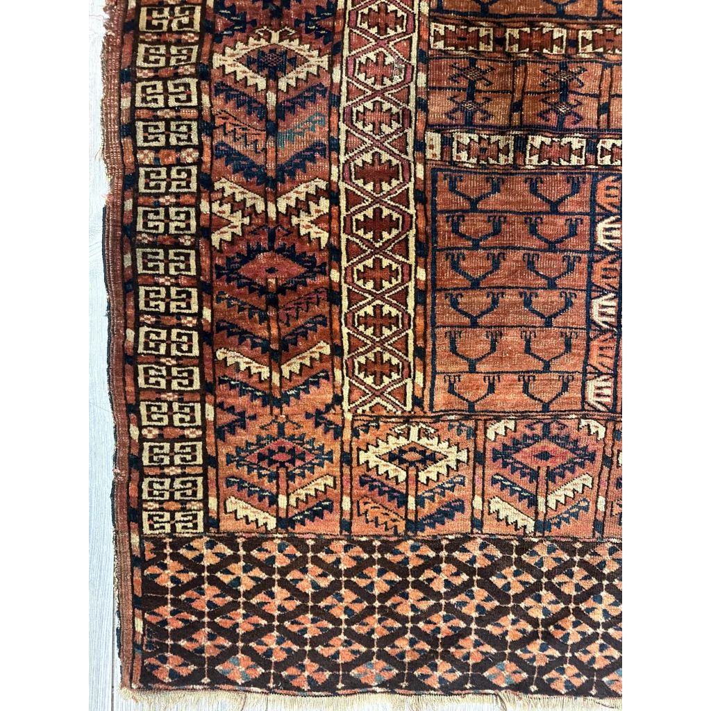 Vintage Turkmen geometric rug in rich earthy tones