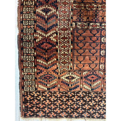 Vintage Turkmen geometric rug in rich earthy tones