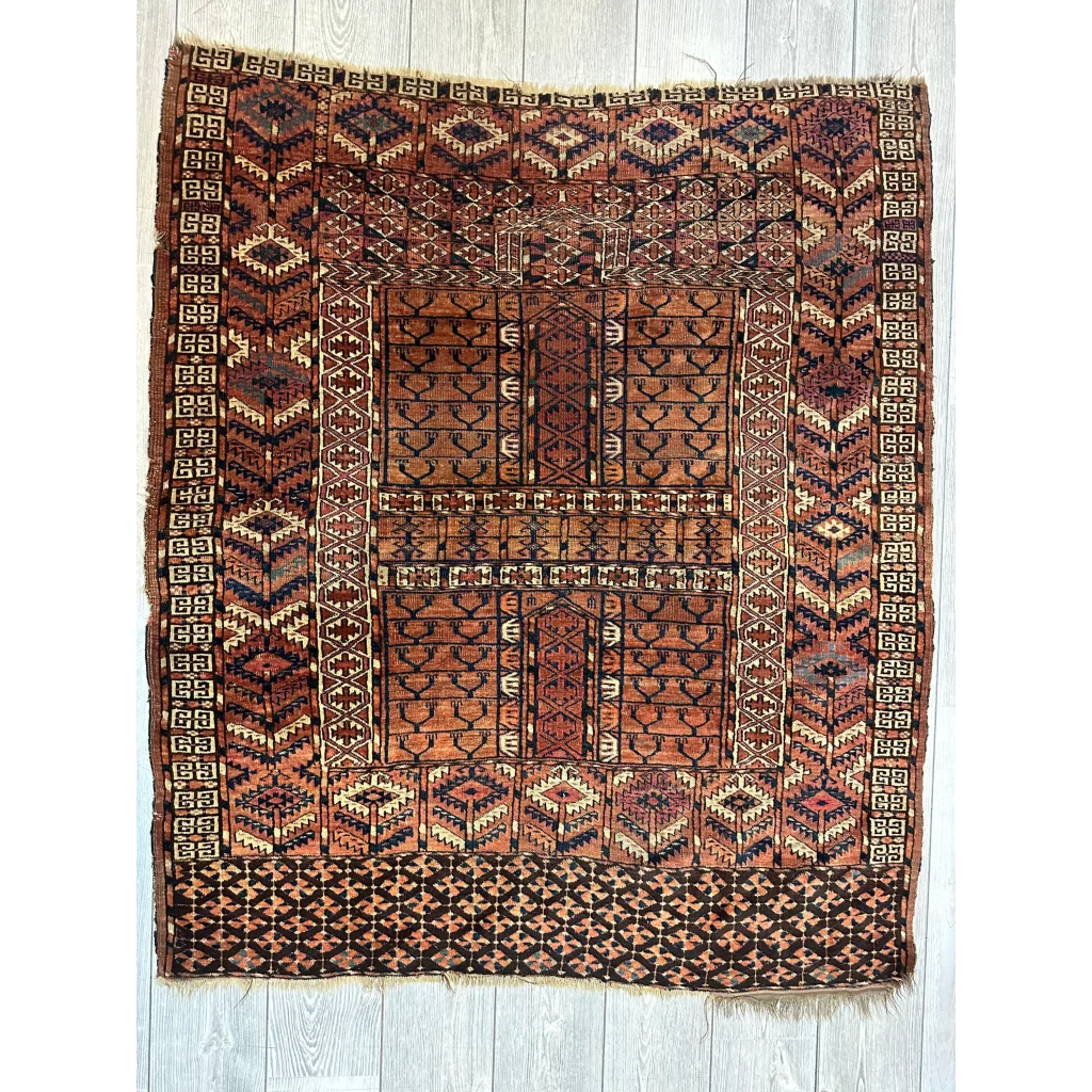 Antique late 19th century Turkmen Ensi rug in rich earthy rust and terracotta tones