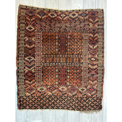 Antique late 19th century Turkmen Ensi rug in rich earthy rust and terracotta tones
