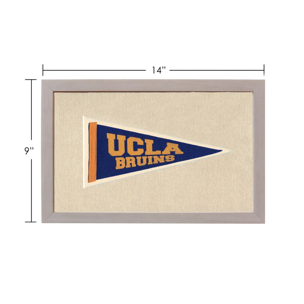 Vintage UCLA pennant framed with navy blue field and gold trim