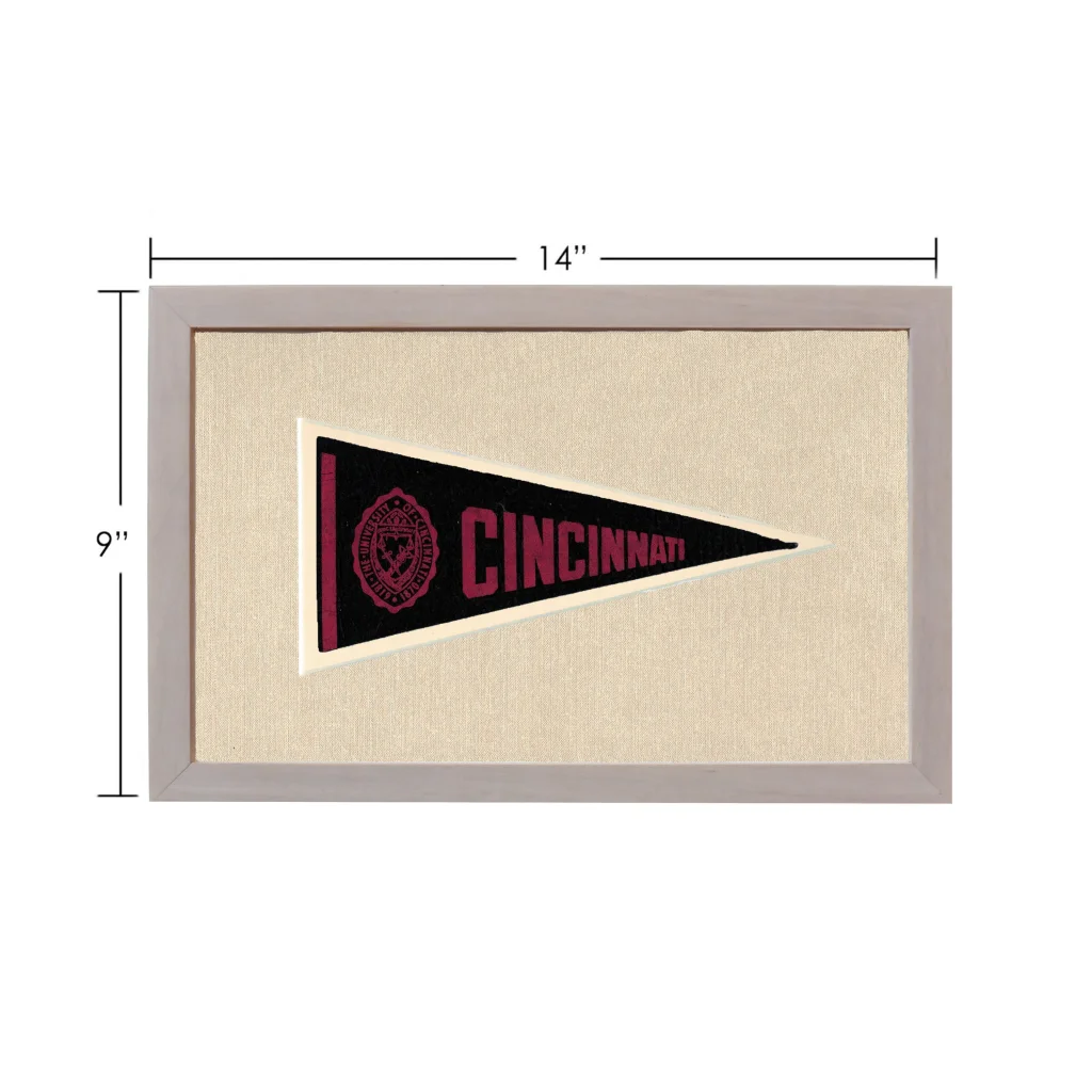 Vintage University of Cincinnati pennant framed on black background