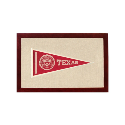 Vintage University of Texas red triangular pennant in dark wood frame
