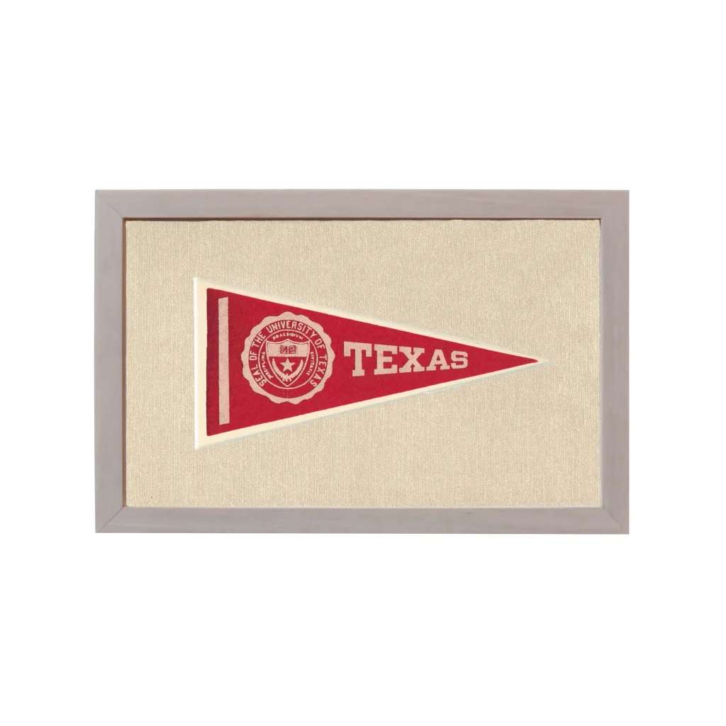 Vintage University of Texas pennant with red design, white lettering, and emblem in gray frame