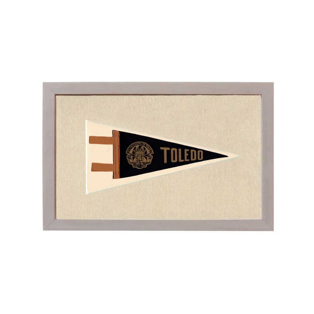 Framed vintage University of Toledo pennant in black, cream, gold