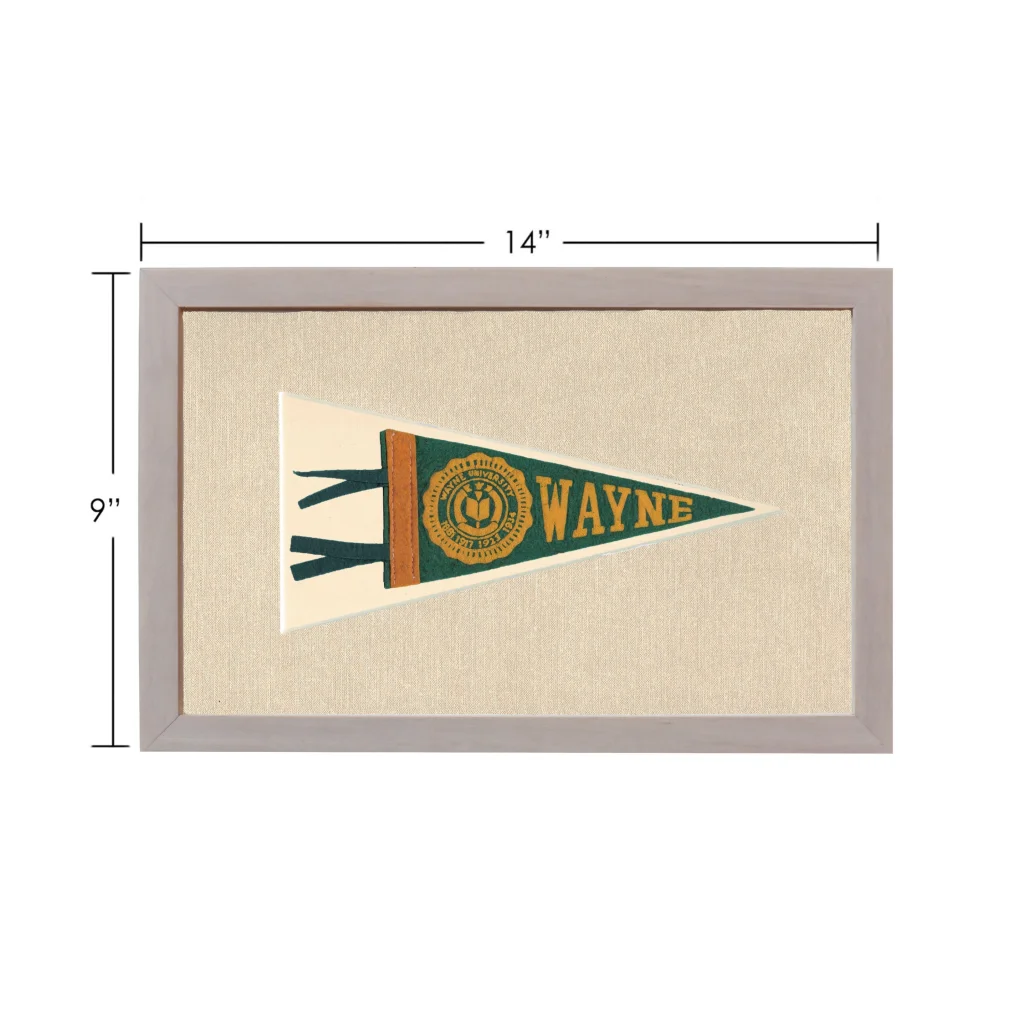 Framed vintage Wayne University pennant in green and gold on beige fabric