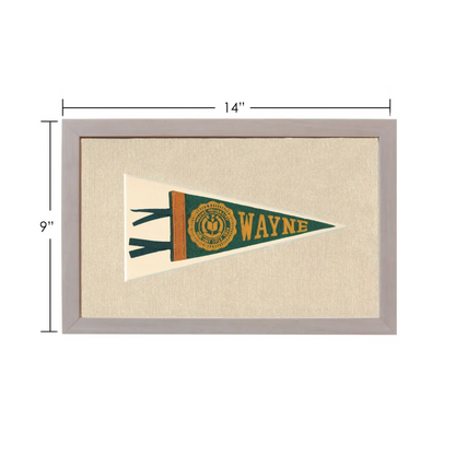 Framed vintage Wayne University pennant in green and gold on beige fabric