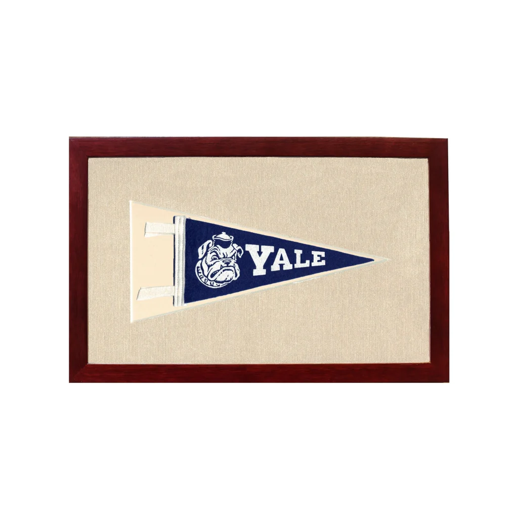 Vintage Yale University pennant in navy blue with white bulldog and lettering, framed