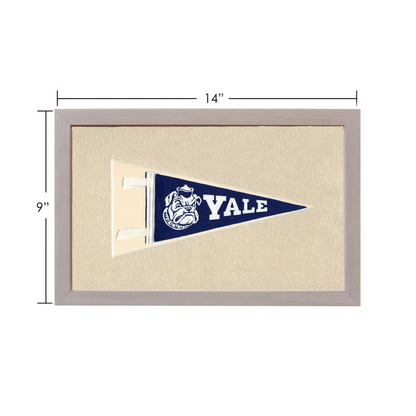 Vintage Yale University pennant with navy blue design, white bulldog mascot, and Yale lettering in light gray frame
