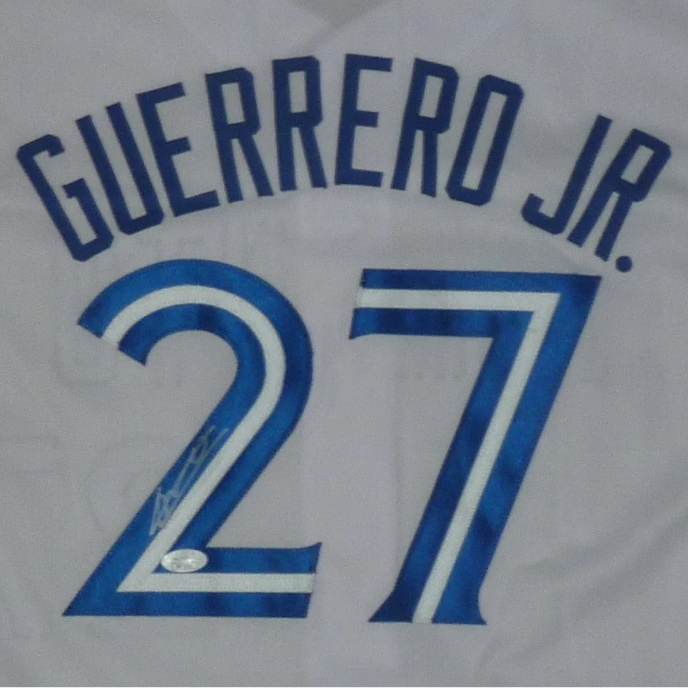 Back of white vladimir guerrero custom jersey with navy blue lettering guerrero jr above number 27 autographed by him