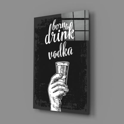 Black and white illustrated glass wall art canvas print of hand holding shot glass with Born to Drink Vodka text