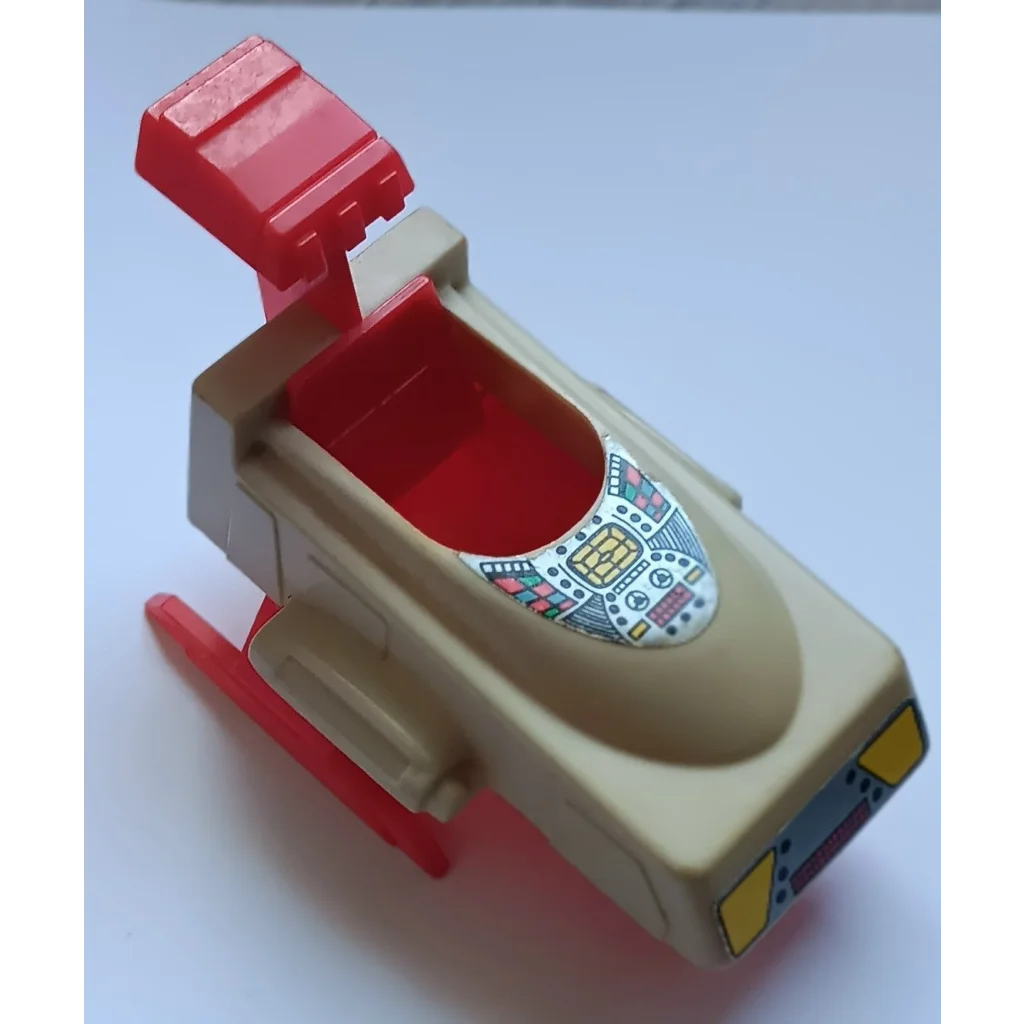 Beige and red plastic toy gun with flip-open magazine from Voltron scout ship vehicle