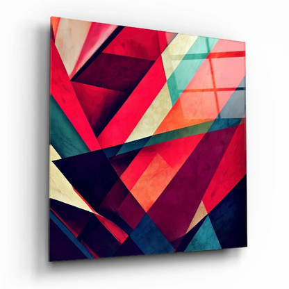 Bold geometric glass wall art in vibrant red, teal, and purple