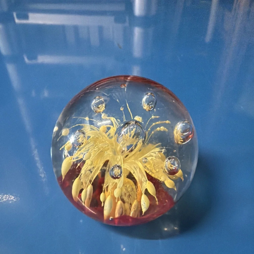 Vtg art glass oval paperweight with golden flower design and silver bubbles
