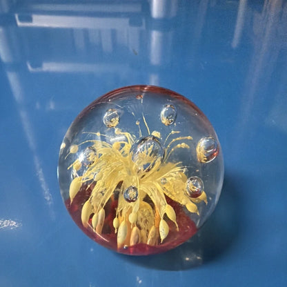 Vtg art glass oval paperweight with golden flower design and silver bubbles