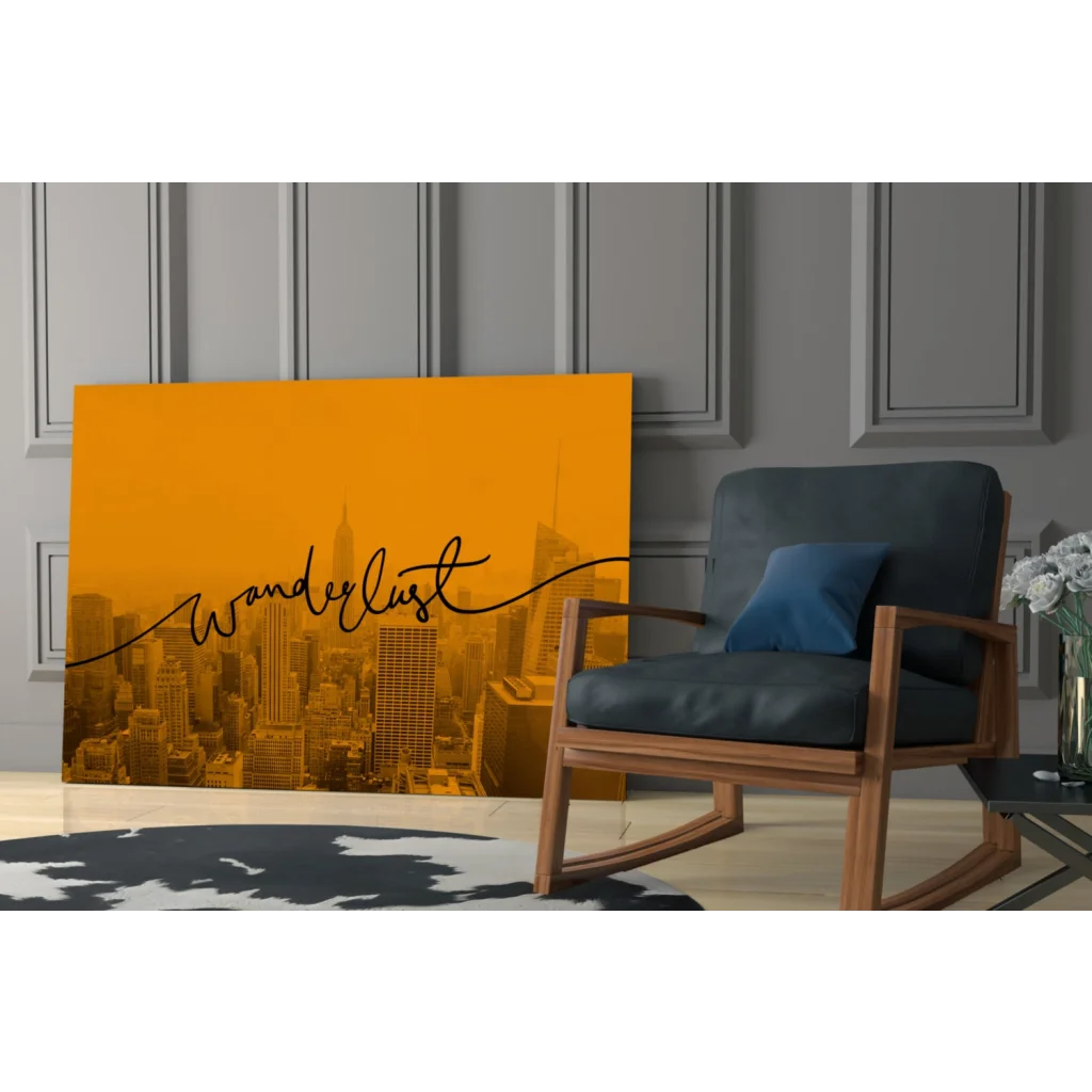 Vibrant orange glass wall art with city skyline and wanderlust script