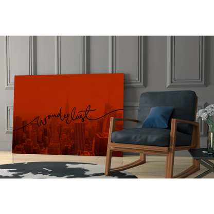 Vibrant orange cityscape wall art with Wanderlust script