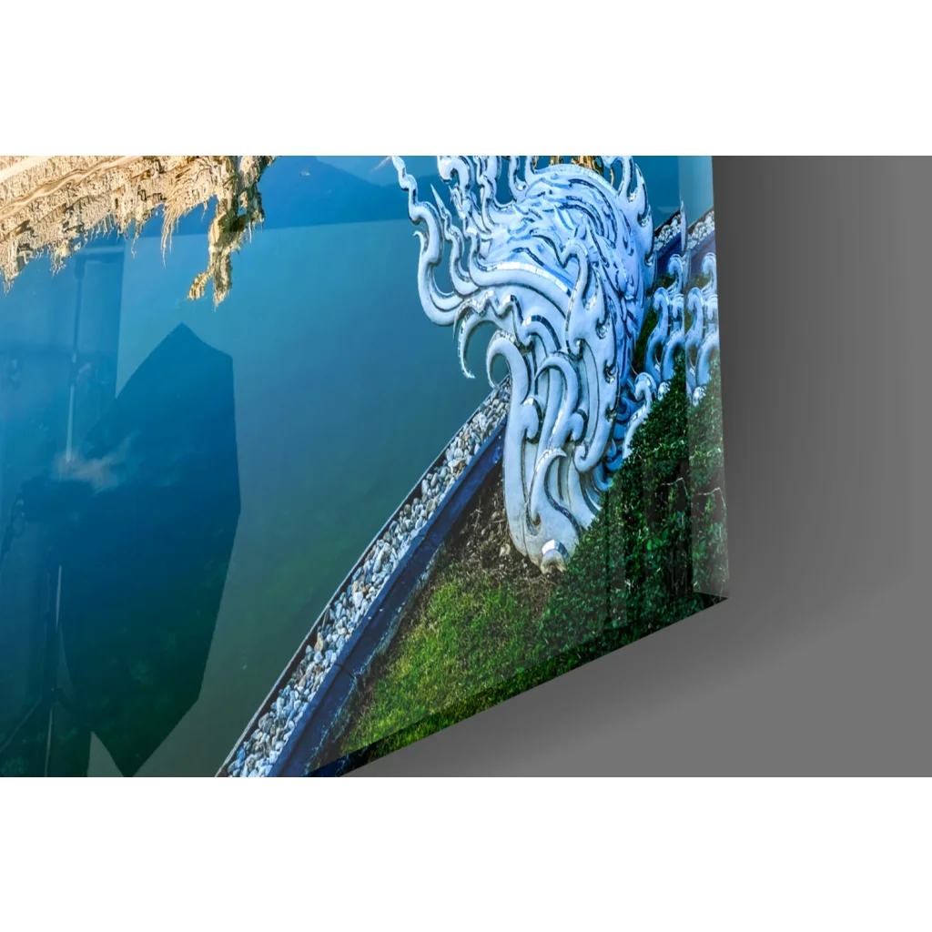 Vibrant ornate white dragon glass wall art print reflected in blue water