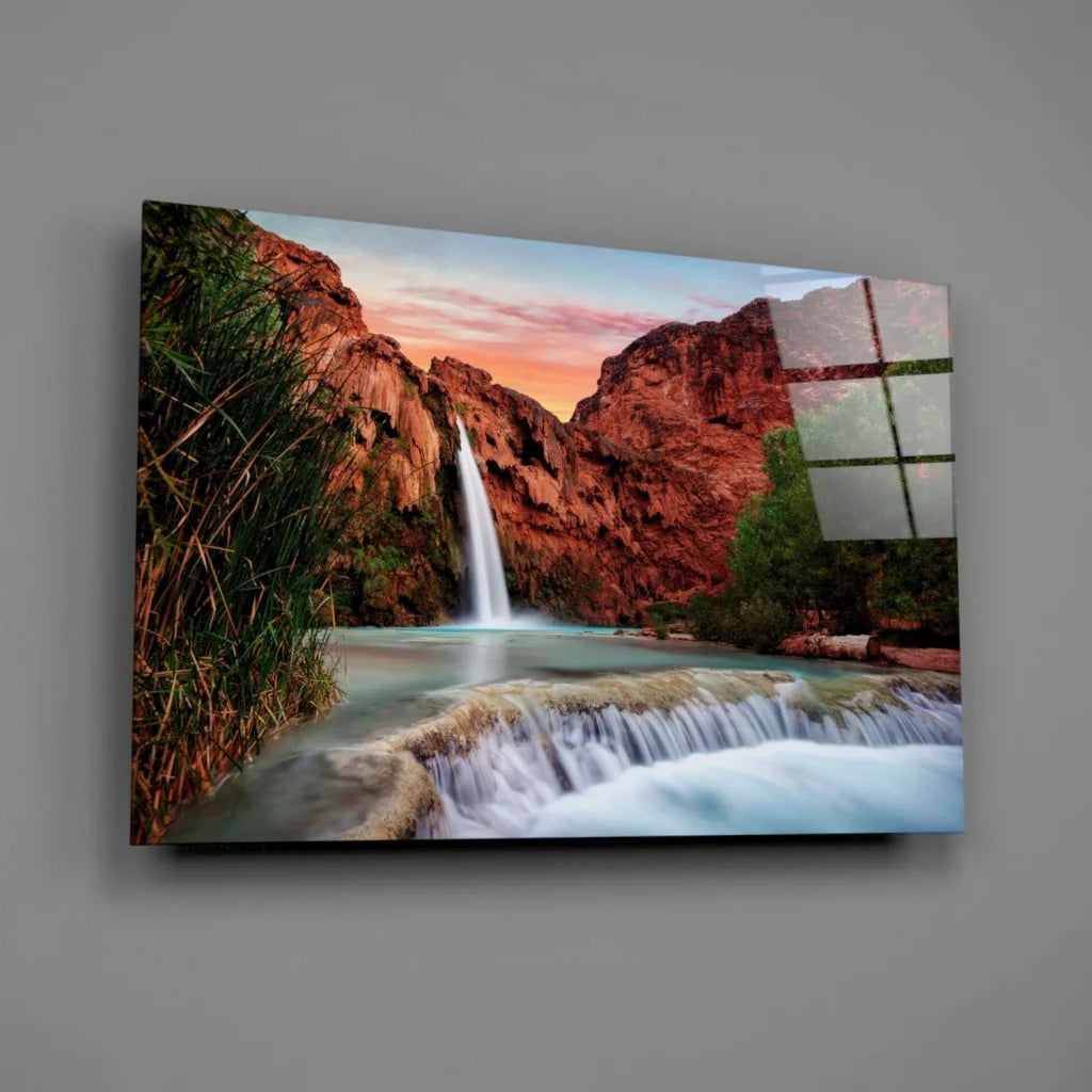 Vibrant sunset waterfall glass wall art in red canyon cliffs
