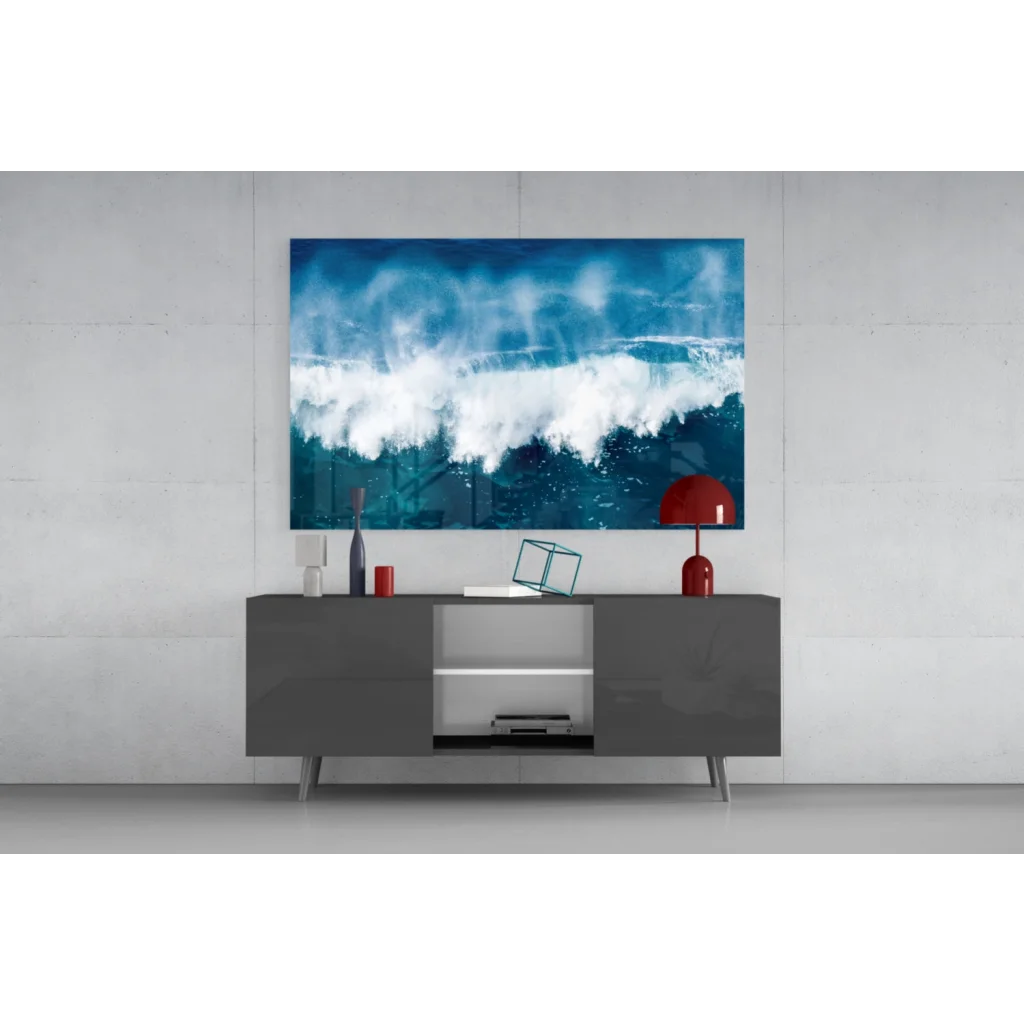 Vibrant blue wave glass wall art above modern gray console table