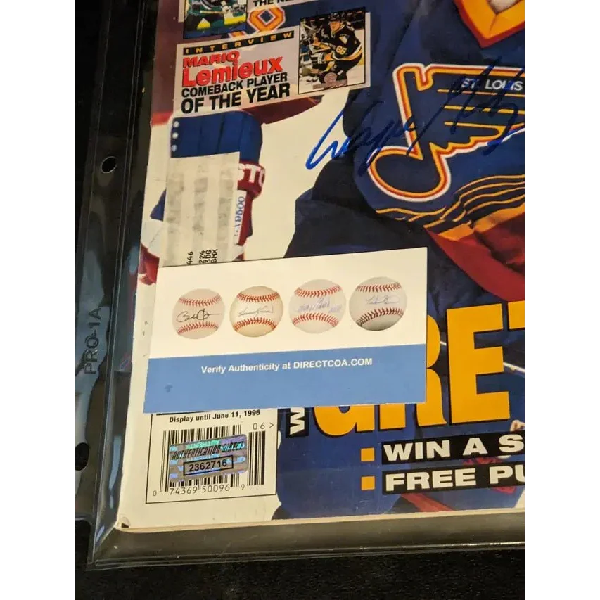 Wayne Gretzky autographed hockey magazine with authentication stickers and autographed price guide
