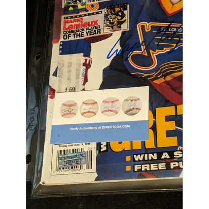 Wayne Gretzky autographed hockey magazine with authentication stickers and autographed price guide