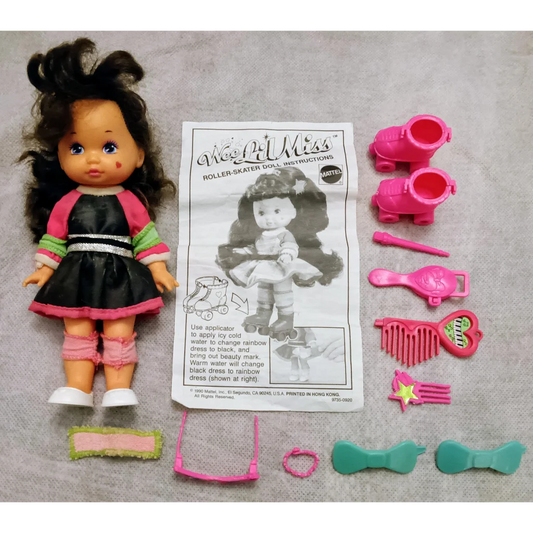 Wee Lil Miss 90s roller skater doll with black hair and pink dress