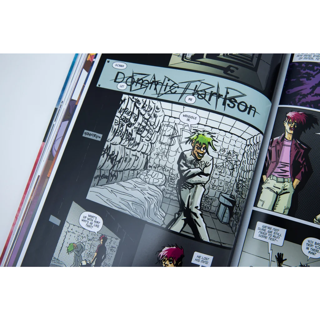 Open comic book showing illustrated panels from Weird Times at Quarry Bank University