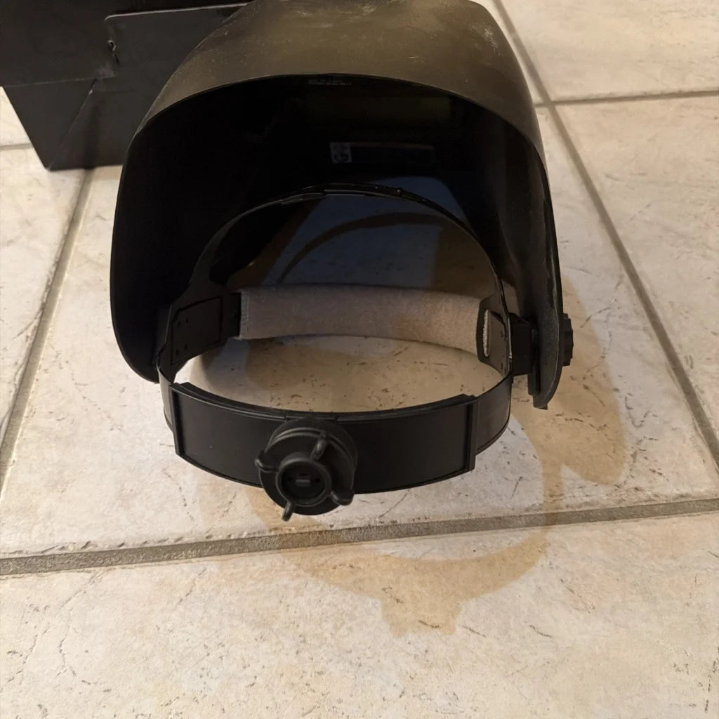 Chicago Electric black plastic welding helmet with dark visor