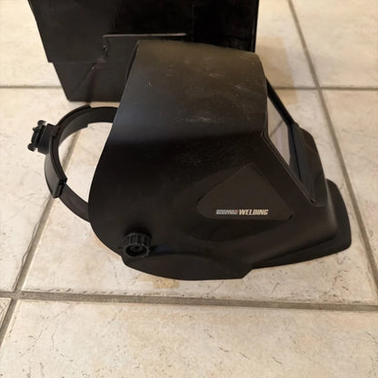 Black Chicago Electric welding helmet with matte finish and adjustable strap