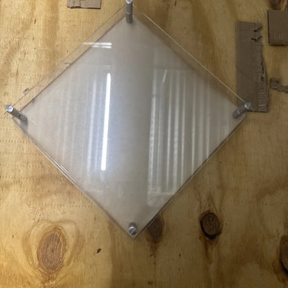 Clear diamond acrylic framed photo display with silver brackets