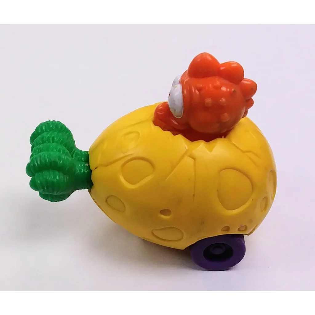 Yellow Surprize Egg Dinosaur toy submarine with purple wheels