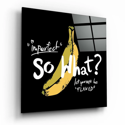 Yellow speckled banana on glass wall art with motivational text