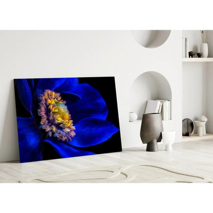 Vibrant blue flower glass wall art on black canvas with yellow purple stamens