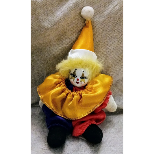 Whimsical jester doll plush toy with colorful costume and pom-pom hat