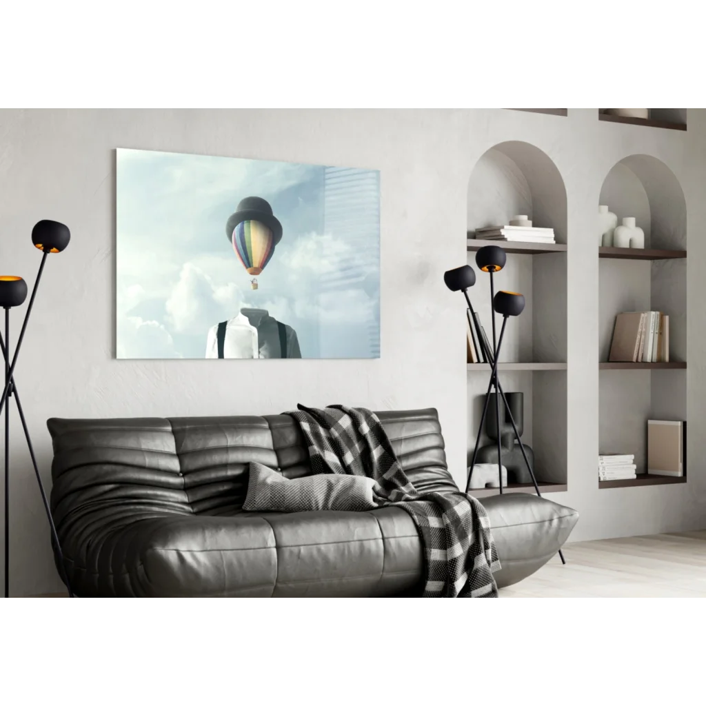 Whimsical rainbow hot air balloon wall art on black leather sofa