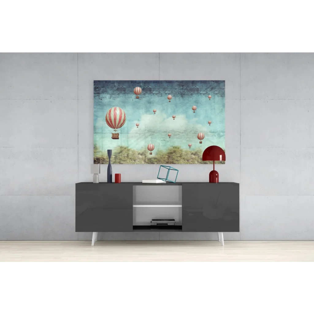 Modern black TV stand with sleek white legs and silver accents under Whimsical Vintage Hot Air Balloon wall art