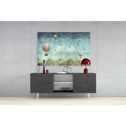 Modern black TV stand with sleek white legs and silver accents under Whimsical Vintage Hot Air Balloon wall art