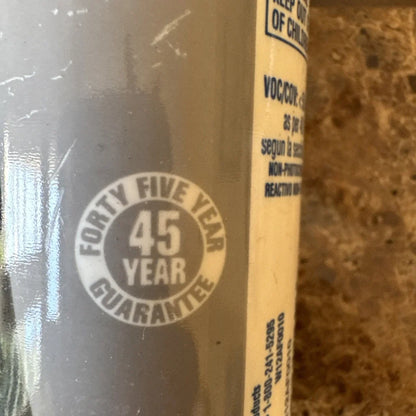 White Lightning adhesive caulk bottle with 45-year guarantee label
