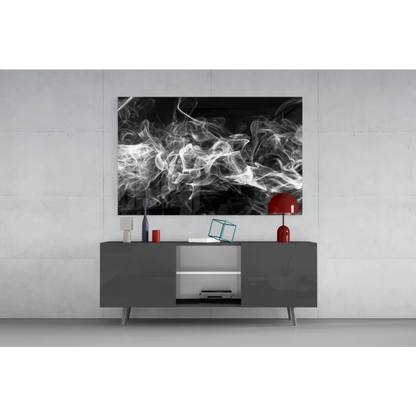 Black and white smoke swirls glass wall art above gray console